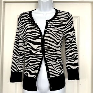 Tiger prints in black and white coloring. Crystal buttons. Light weight.